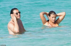41915890-9484959-Quick_dip_The_couple_got_the_best_of_both_the_ocean_and_the_pool-a-52_1618779449198.jpg