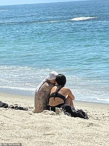 41966046-9489027-Loved_up_The_couple_couldn_t_have_looked_any_happier_snuggling_b-a-1_1618888531149.jpg