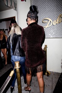 Rihanna---Night-out-in-a-brown-fringe-mini-dress-and-strappy-heels-at-Delilah-in-West-Hollywood-09.jpg