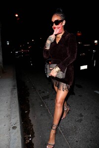 Rihanna---Night-out-in-a-brown-fringe-mini-dress-and-strappy-heels-at-Delilah-in-West-Hollywood-16.jpg