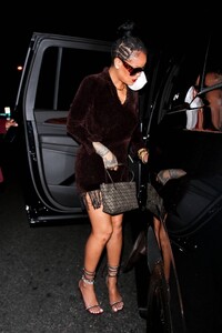 Rihanna---Night-out-in-a-brown-fringe-mini-dress-and-strappy-heels-at-Delilah-in-West-Hollywood-22.jpg