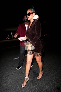 Rihanna---Night-out-in-a-brown-fringe-mini-dress-and-strappy-heels-at-Delilah-in-West-Hollywood-24.jpg