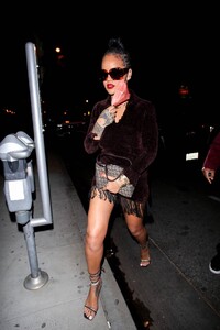 Rihanna---Night-out-in-a-brown-fringe-mini-dress-and-strappy-heels-at-Delilah-in-West-Hollywood-25.jpg