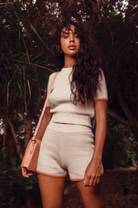 The-Wolf-Gang-Le-Jardin-Autumn-21-Nahla-Open-Back-Knit-Tee-Bone-Nahla-Knit-Short-Bone-Avery-Messenger-Cross-Body-Bag-Peach-2715.png