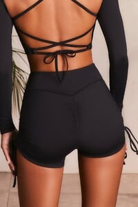 bt0119_bt0121_9_fast-pace-lifestyle-black-ruched-high-waisted-tie-up-shorts-long-sleeved-ruched-tie-up-back-crop-top-zoom.jpg