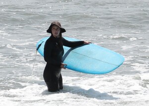 leighton-meester-in-wetsuit-surfing-in-malibu-04-14-2021-0.jpg