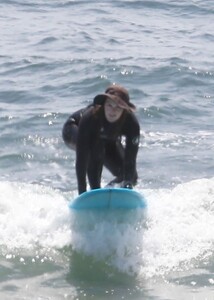 leighton-meester-in-wetsuit-surfing-in-malibu-04-14-2021-2.jpg