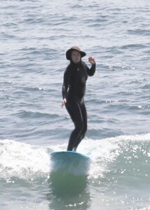 leighton-meester-in-wetsuit-surfing-in-malibu-04-14-2021-3.jpg