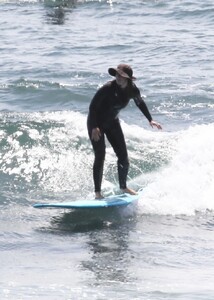 leighton-meester-in-wetsuit-surfing-in-malibu-04-14-2021-4.jpg