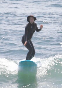 leighton-meester-in-wetsuit-surfing-in-malibu-04-14-2021-6.jpg