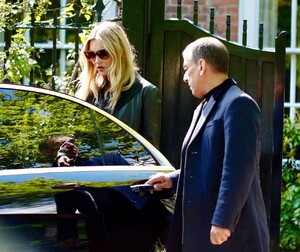 kate-moss-in-a-long-black-coat-and-dark-sunglasses-london-05-19-2021-4.jpg