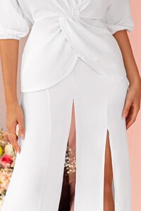 CL125625-Ivory1-Plunge-Twist-Detail-Long-Sleeve-Top-CL125626-Ivory-Wide-Leg-Tailored-Trousers-With-Split-1_94ce63ed-5824-40a8-a712-ebe99f1f1ff1_1200x.jpg