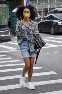 yara-shahidi-in-a-printed-top-denim-shorts-and-white-sneakers-new-york-09-12-2021-0.jpeg