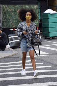 yara-shahidi-in-a-printed-top-denim-shorts-and-white-sneakers-new-york-09-12-2021-2.jpeg