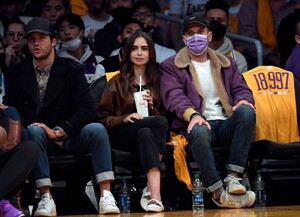 lily-collins-at-golden-state-warriors-vs.-la-lakers-game-at-staples-center-10-19-2021-0.jpg