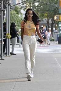 laura-harrier-in-a-tie-die-shirt-and-off-white-pants-and-white-sneakers-new-york-09-12-2021-2.jpg