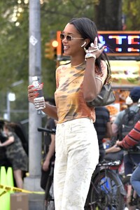 laura-harrier-in-a-tie-die-shirt-and-off-white-pants-and-white-sneakers-new-york-09-12-2021-4.jpg