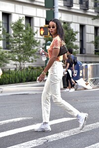 laura-harrier-in-a-tie-die-shirt-and-off-white-pants-and-white-sneakers-new-york-09-12-2021-6.jpg