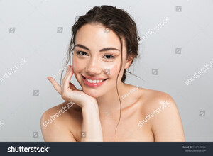 stock-photo-beauty-portrait-of-a-happy-young-topless-woman-with-make-up-looking-at-camera-isolated-over-gray-1147145294.jpg