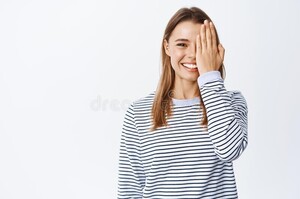 cheerful-blond-girl-with-white-smile-covering-half-face-with-hand-staring-front-before-after-effect-white-wall_176420-38976.jpg