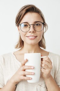 cute-beautiful-girl-glasses-smiling-holding-cup_176420-9551.jpg