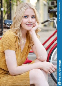 portrait-beautiful-romantic-blond-girl-dress-dreamily-looking-camera-street-city-184859967.jpg