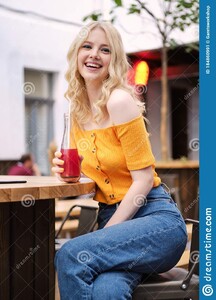 pretty-joyful-blond-girl-happily-looking-camera-lemonade-resting-courtyard-cafe-pretty-joyful-blond-girl-happily-184860991.jpg