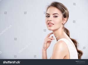 stock-photo-portrait-of-a-smiling-young-woman-with-a-brown-hair-beautiful-young-female-model-with-healthy-1586484673.jpg
