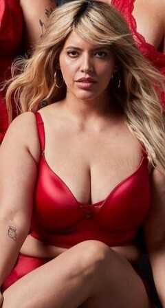 Torrid blonde busty model in red lingerie