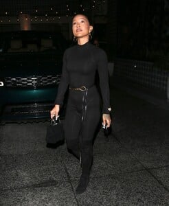 karrueche-tran-wears-a-one-piece-black-bodysuit-and-knee-high-boots-west-hollywood-01-15-2022-6.jpg