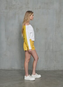monse-bi-color-cropped-off-the-shoulder-sweater-in-ivory-mustard-on-model-side-view.jpg