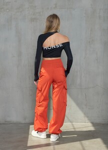 monse-long-sleeve-cut-out-crop-top-black-on-model-back-view.jpg