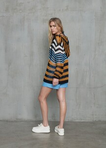 monse-oversized-striped-knit-hoodie-black-multi-on-model-side-view.jpg
