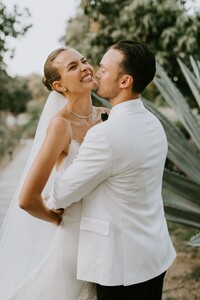 Credit_Courtney%20Pecorino%20-%20The%20bride%20and%20groom%20embrace%20after%20the%20ceremony%20at%20Acre%20Baja..jpg