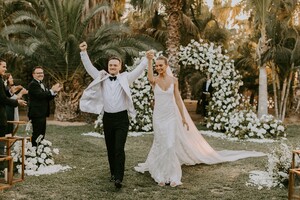 Credit_Courtney%20Pecorino%20-%20A%20triumphant%20walk%20down%20the%20aisle.%20The%20groom%20wears%20custom%20David%20August,%20the%20bride%20wears%20custom%20Alberta%20Ferretti..jpg