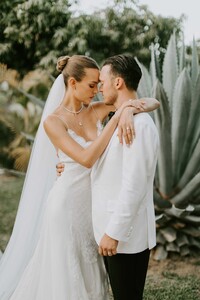 credit_courtney-pecorino---a-tender-embrace-after-the-ceremony-jewelry-by-logan-hollowell-custom-dress-by-alberta-ferretti.thumb.jpg.b77c1c929a90e76a7dd16728168c1b42.jpg