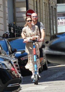 lily-collins-and-charlie-mcdowell-using-an-electric-sharing-scooter-in-paris-07-02-2022-2.jpg