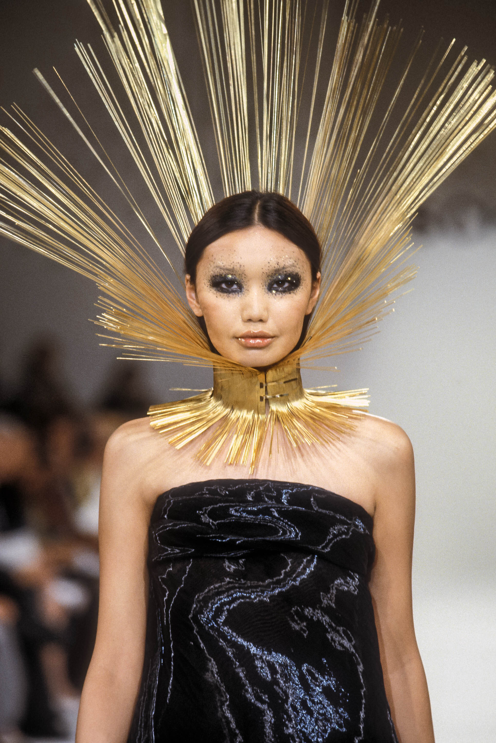 A model walks in the Louis Feraud Spring 1999 Couture Runway Show