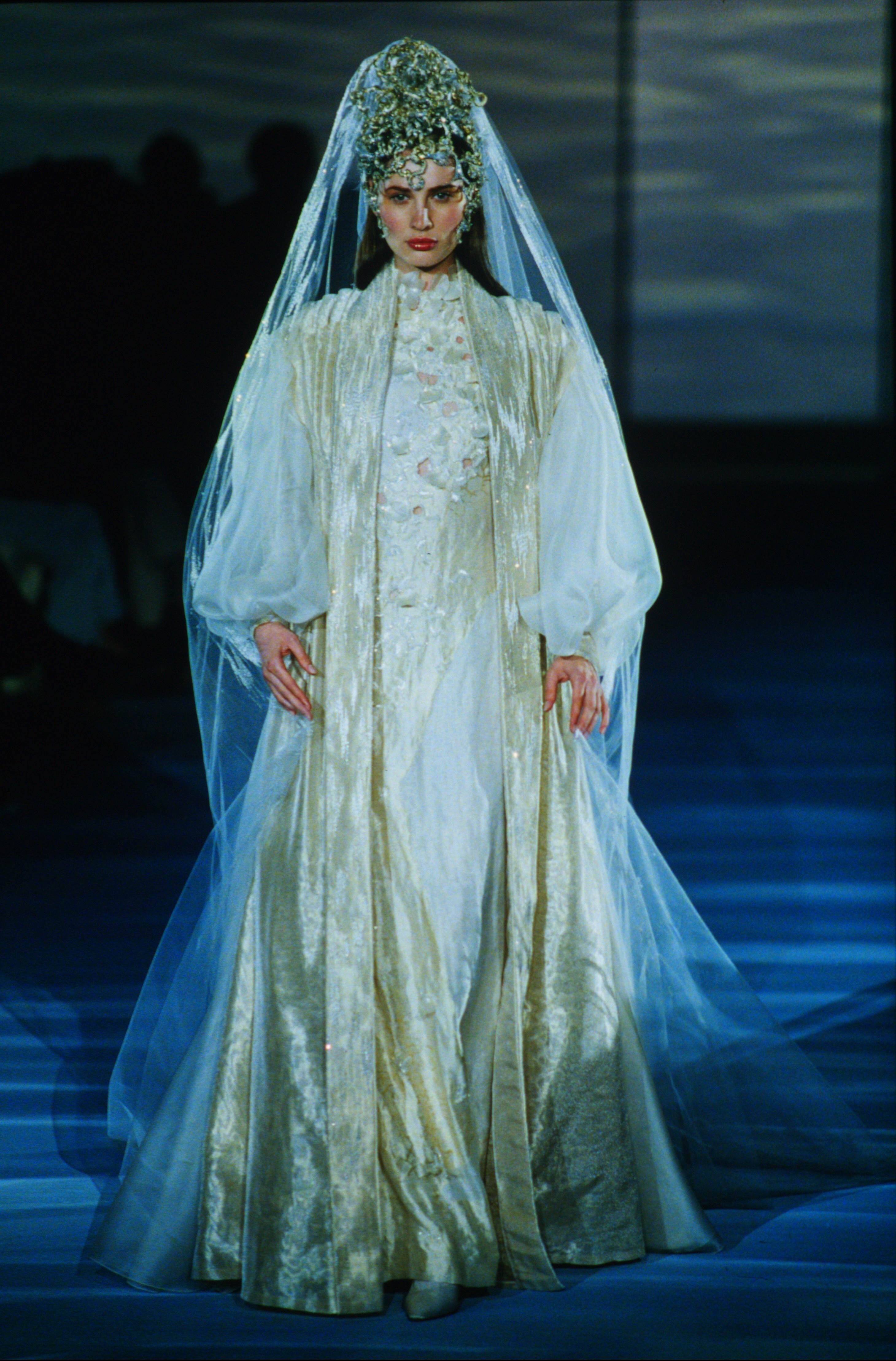 A model walks in the Louis Feraud Spring 1999 Couture Runway Show