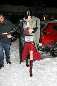 kendall-jenner-in-a-red-dress-and-a-black-leather-coat-aspen-12-29-2022-0.jpg