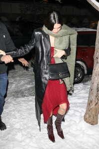 kendall-jenner-in-a-red-dress-and-a-black-leather-coat-aspen-12-29-2022-1.jpg