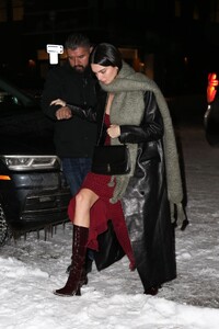 kendall-jenner-in-a-red-dress-and-a-black-leather-coat-aspen-12-29-2022-4.jpg