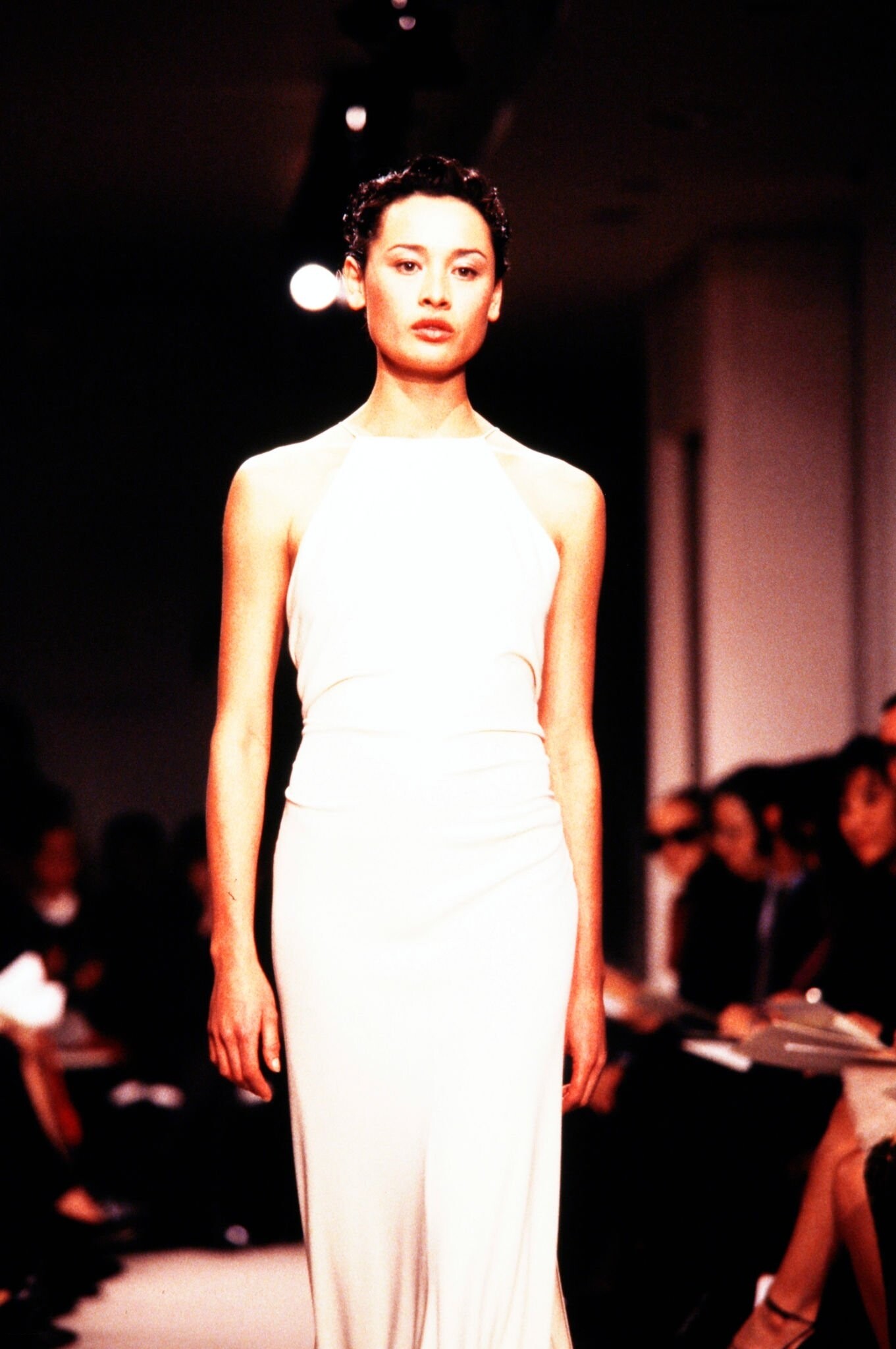 A model walks in the Louis Feraud Spring 1999 Couture Runway Show