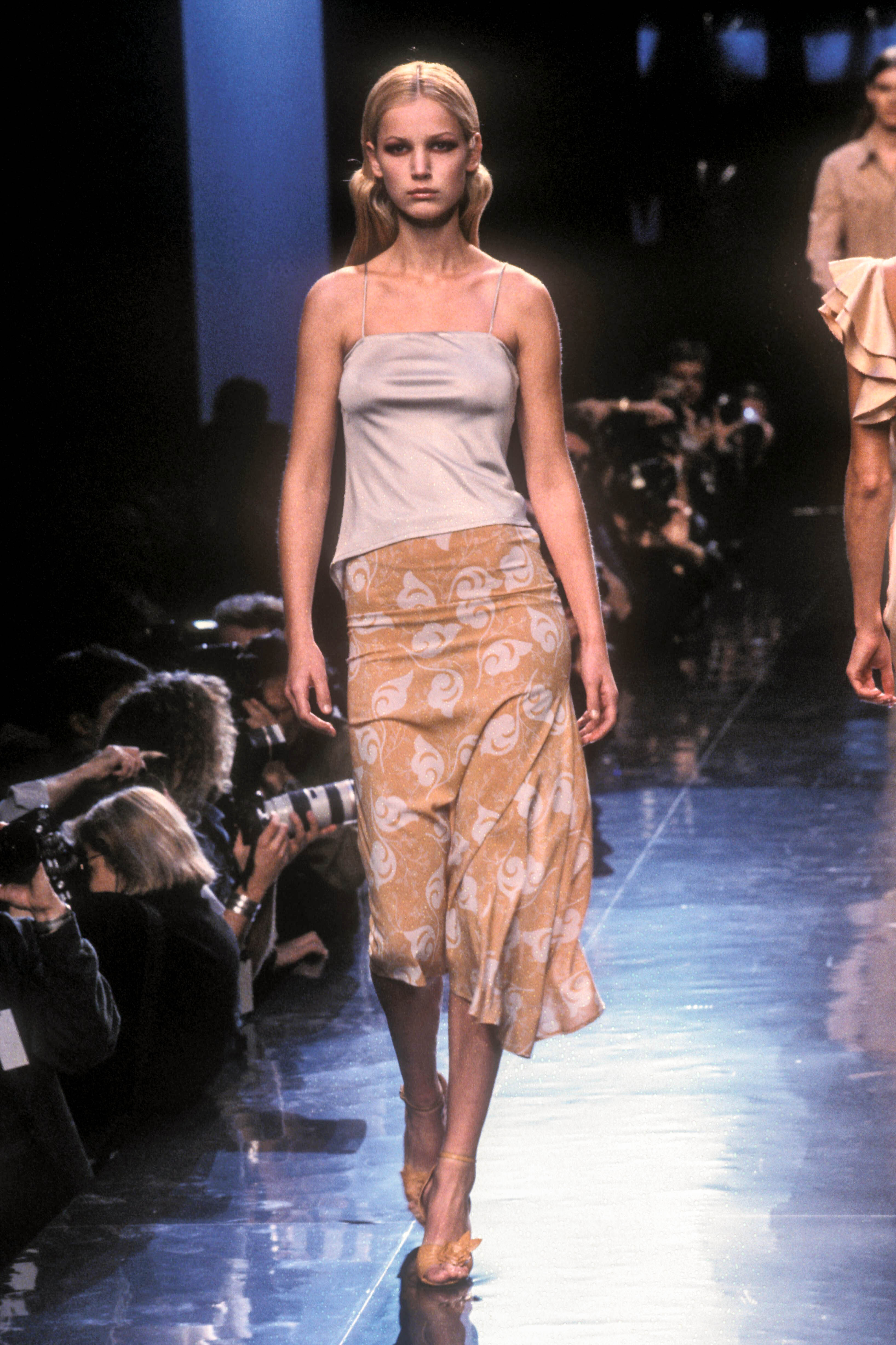 A model walks in the Louis Feraud Spring 1999 Couture Runway Show