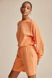 WELLNESSSTUDIO-LONGSLEEVE-TANGERINE-5.webp