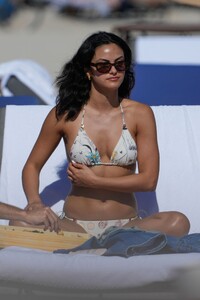 camila-mendes-in-floral-print-white-bikini-on-the-beach-in-miami-01-01-2023-1.jpg