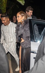 Jennifer-Lopez---Wears-slit-black-satin-dress-at-her-Revolve-Launch-Party-in-L.A-12.jpg