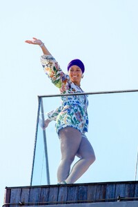 alicia-keys-wearing-a-colored-flower-print-romper-and-a-purple-headband-rio-05-03-2023-6.jpg