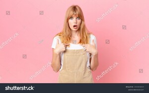 stock-photo-pretty-red-head-woman-feeling-happy-and-pointing-to-self-with-an-excited-2100708925.jpg