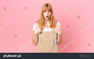 stock-photo-pretty-red-head-woman-feeling-happy-and-pointing-to-self-with-an-excited-2100708925.jpg